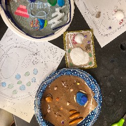 Examples of students' 3D representations of cells are on display on a science lab table.