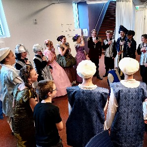 Students in a circle before the show