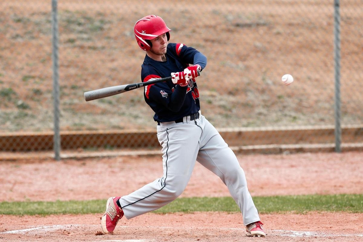 An LHS player swings his bat during a game.