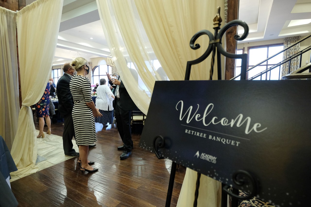 Retirees from the ASD20 2021 Retiree Banquet enter the event.