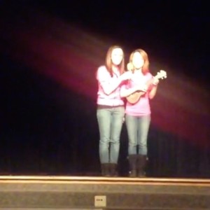 Two girls singing