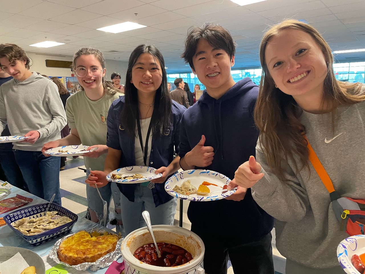 Students filling their plates in the buffet line