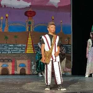 Student performing as Aladdin