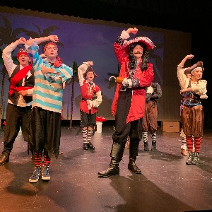 Captain Hook dancing with his pirates.