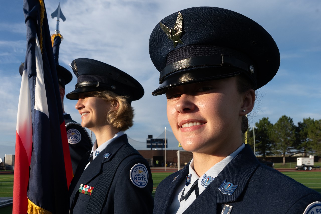 Two AFJROTC students presenting the flags