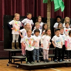 Student sing during a performance.