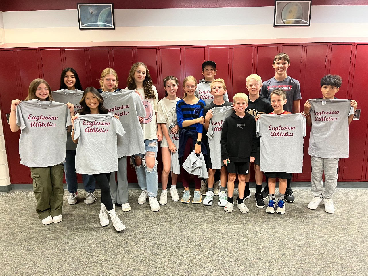 Athletes of the Week 10/1/23 holding up Eagleview Athletics Tshirt prizes