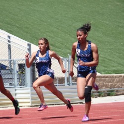 AAHS track athletes compete on the track.