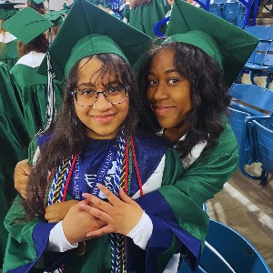 Two girls hugging