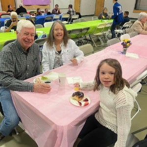 Students enjoy breakfast with their special friends. 