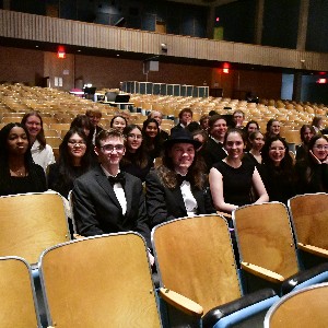 String orchestra students in the theater seats