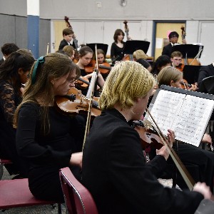 Orchestra students performing in their clinic session.