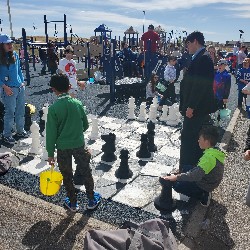 Students playing chess on the playground