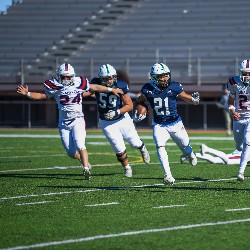 #21 running the ball down the field