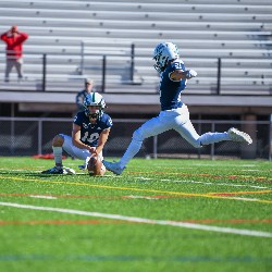 #21 prepares to kick the football