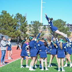 Cheerleaders performing a stunt during the game