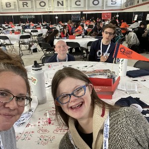 Students smiling at the table