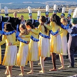 PCHS marching band dancers perform on the field.