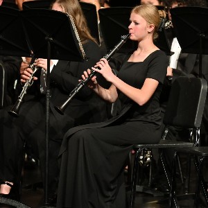 Clarinet player playing in concert