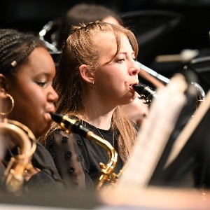 Two students playing alto saxophone