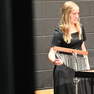 Student playing chimes