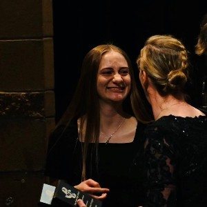 Jenna Yonce accepting an award for being in All State Concert Band 