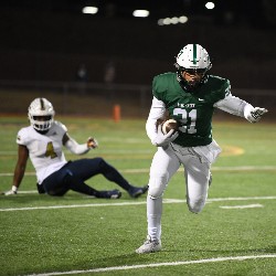 Player #31 running the football down the field