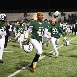 Players running off the field, celebrating the win