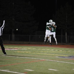 Players jumping in the air in celebration after winning the game.