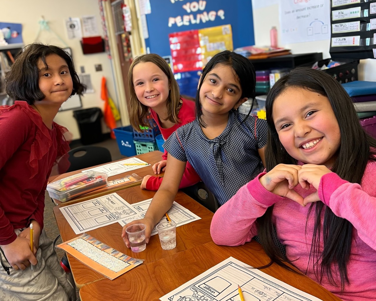 Four students learning about water