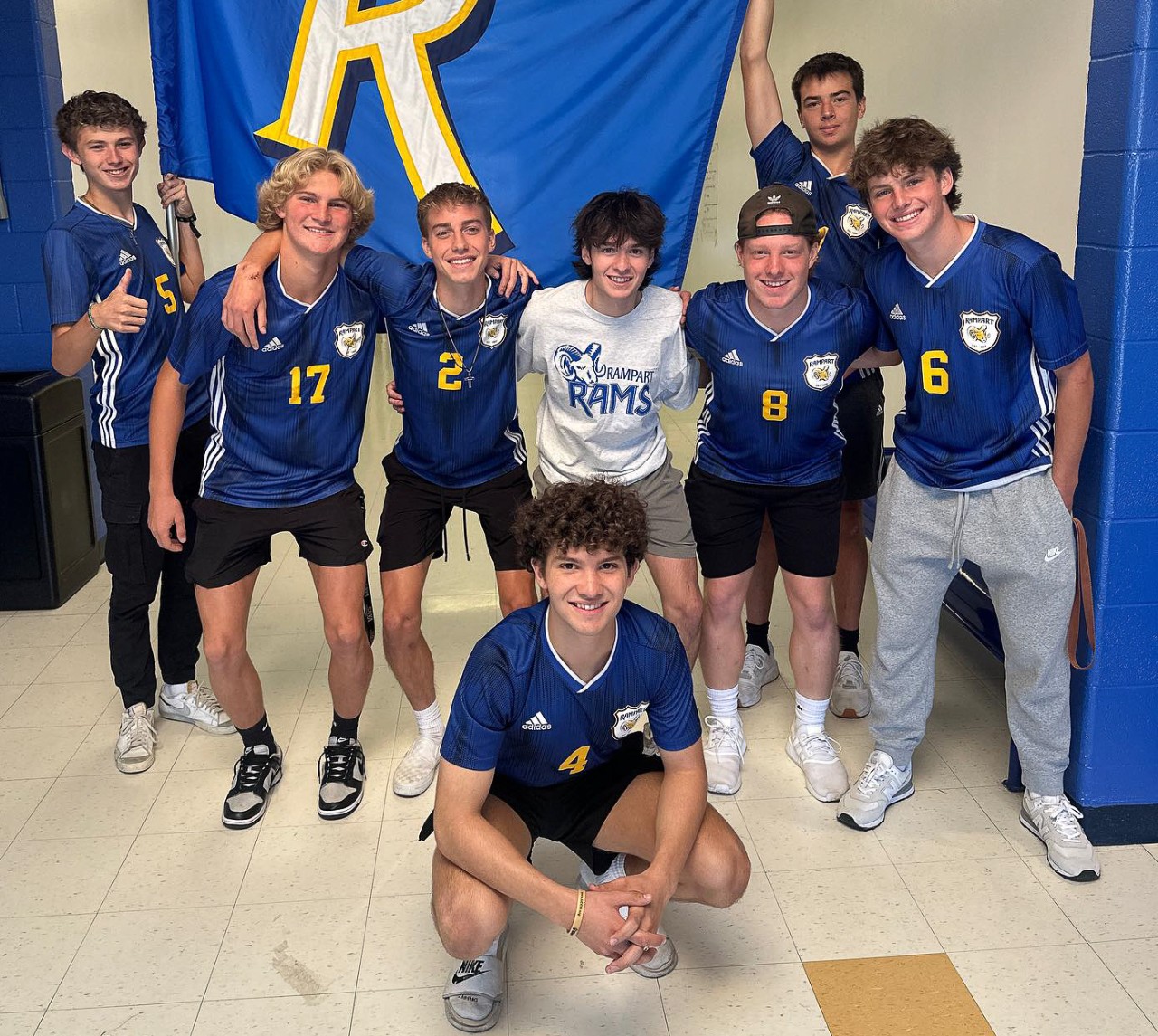 Rampart soccer team with a Rampart flag