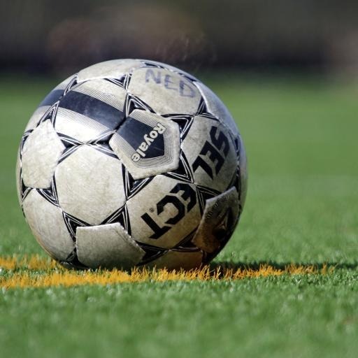 A soccer ball on the playing field.