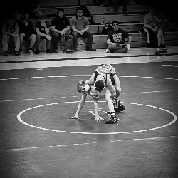 Two wrestlers, engaged in a match.