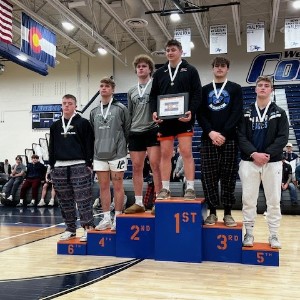 Wrestlers on podium 8