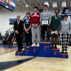 Wrestlers on podium 9