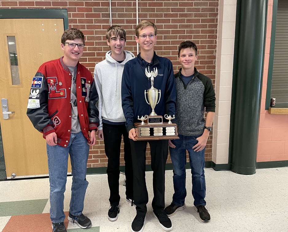 Liberty's Knowledge Bowl "A Team" holds first place trophy at Woodland Park High School on October 8, 2022.
