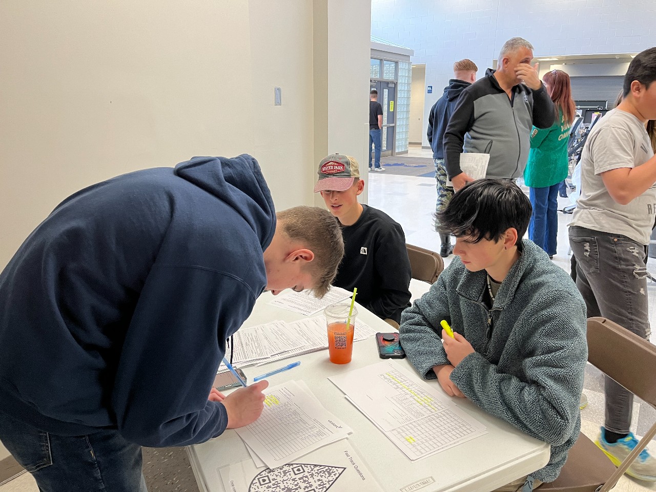 AFJROTC cadets sign in a student donating blood