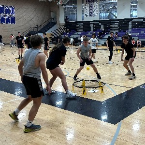 Group playing spikeball