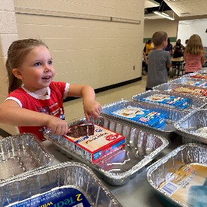 students pack birthday boxes to give back to community