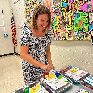 Principal Karie Ebbens packages birthday boxes 