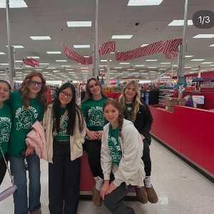 Some Cheer team members pose for a picture in a Target store after an event.