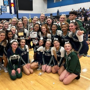 The PCHS Cheer Team poses with an award.