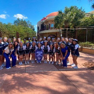 The Cheer team poses with their 3rd place Americas Cup award.