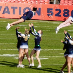 The PCHS Cheer team in action on the football field.