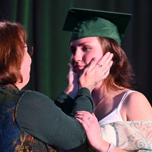 Parent holding student's face