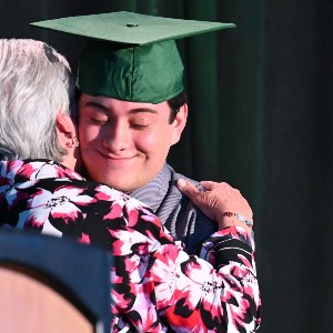 Student hugging his grandma