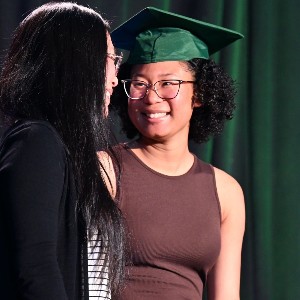 Mother and daughter smiling at each other