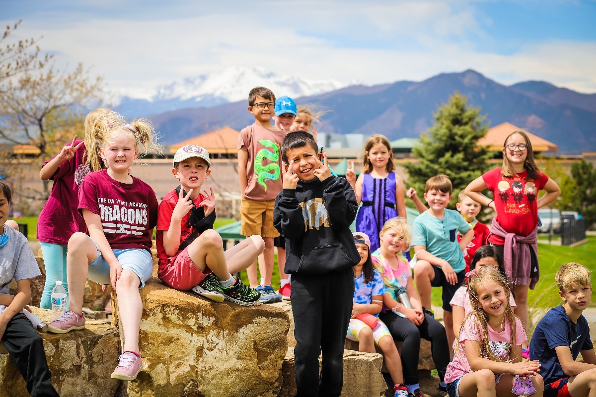 TDVA students pose for a group picture with Pikes Peak in the background.