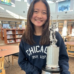 Student holding trophy