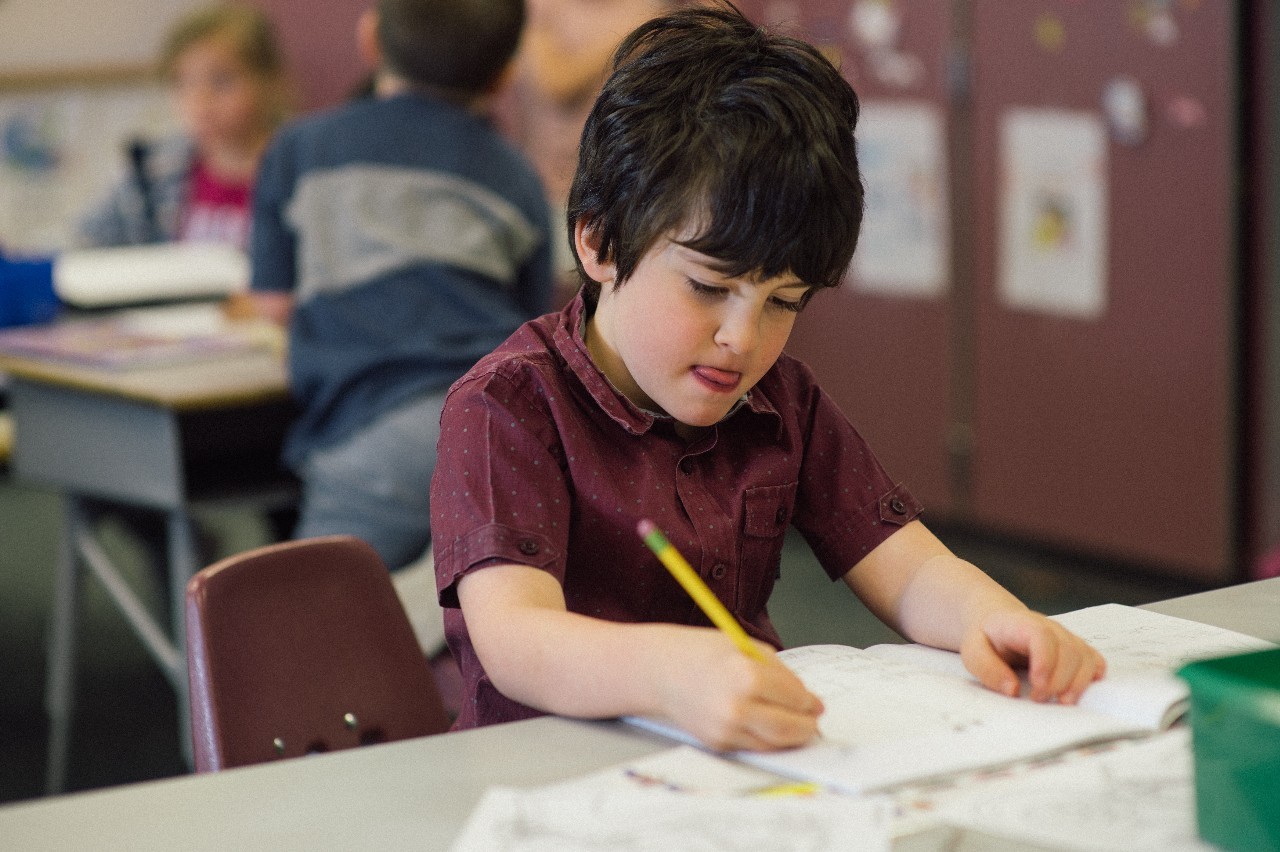 A student at Academy International Elementary School takes a test.